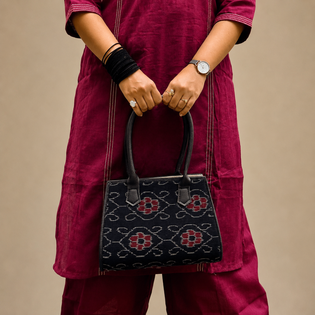Handmade Odisha Black Ikat handbag crafted with authentic Sambalpuri Ikat cotton fabric.