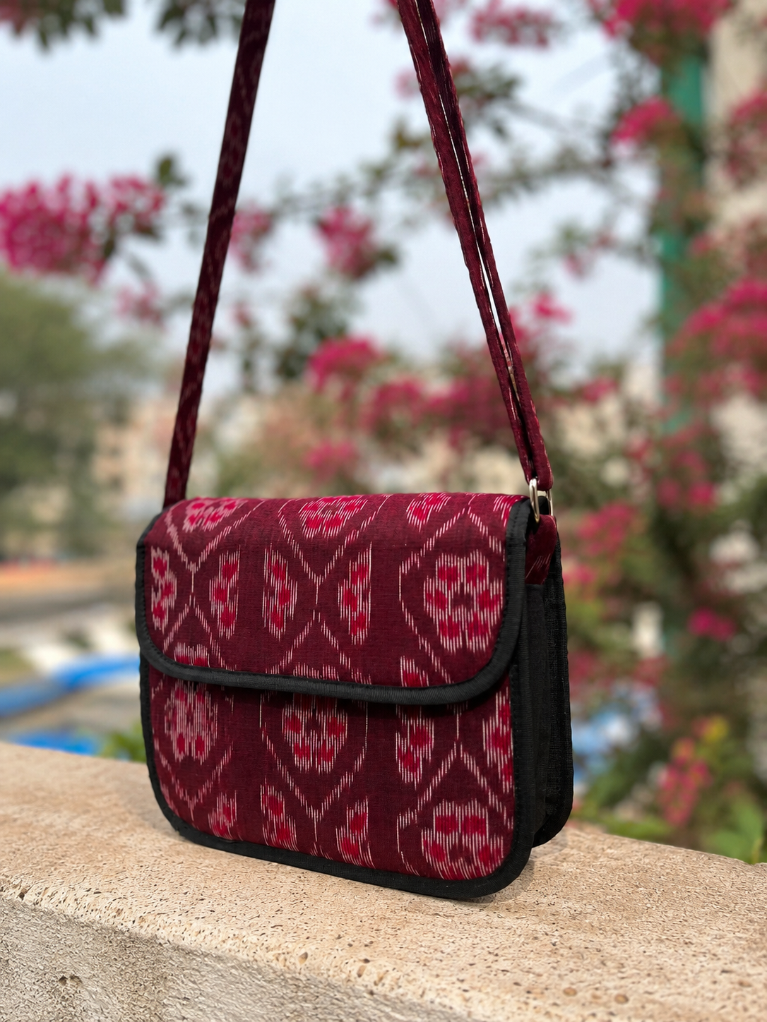 Handcrafted Odisha Ikat Maroon Sling Bag made with authentic Sambalpuri Ikat handloom fabric.