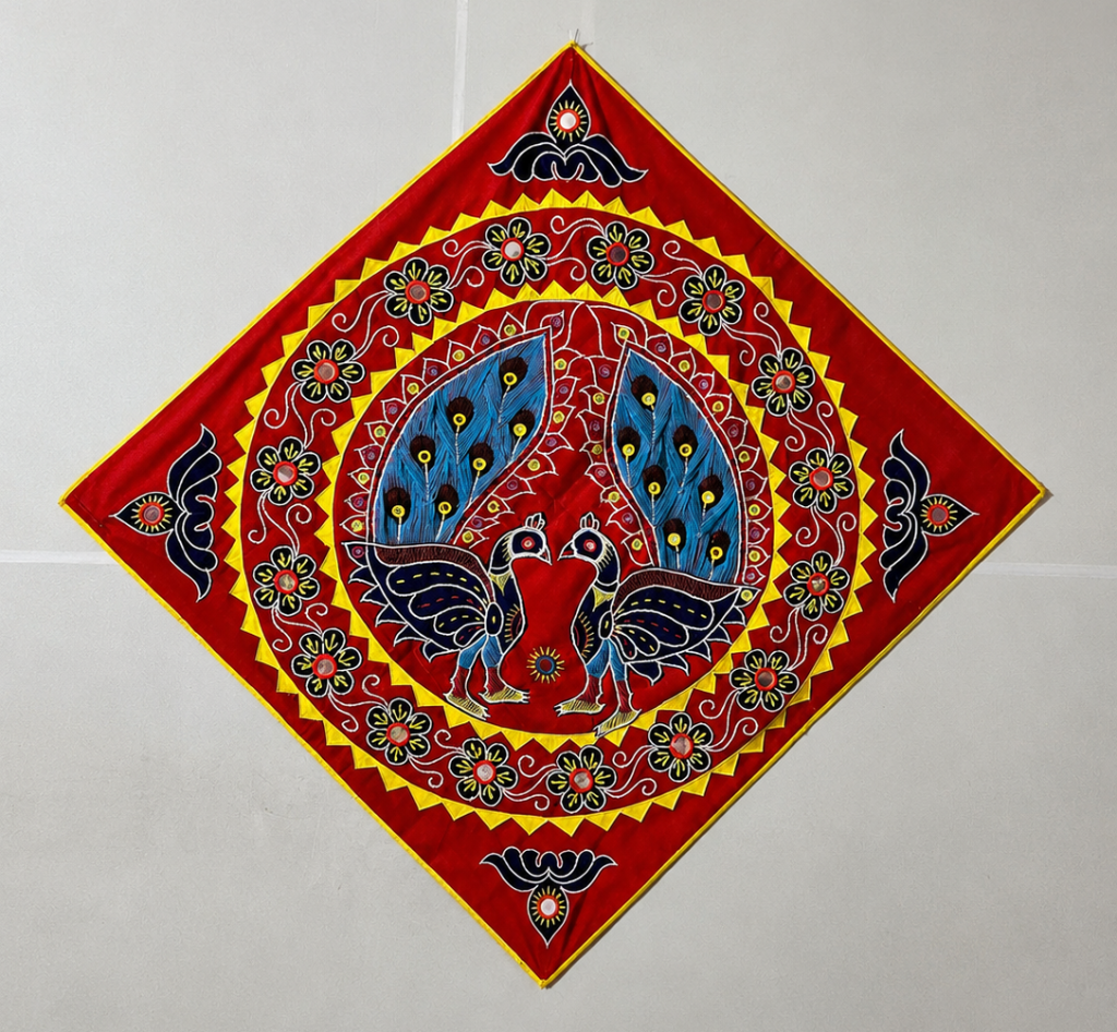 Handmade Pipili Appliqué Peacock Wall Hanging crafted using traditional Odisha appliqué techniques featuring vibrant peacock motifs and decorative floral patterns.