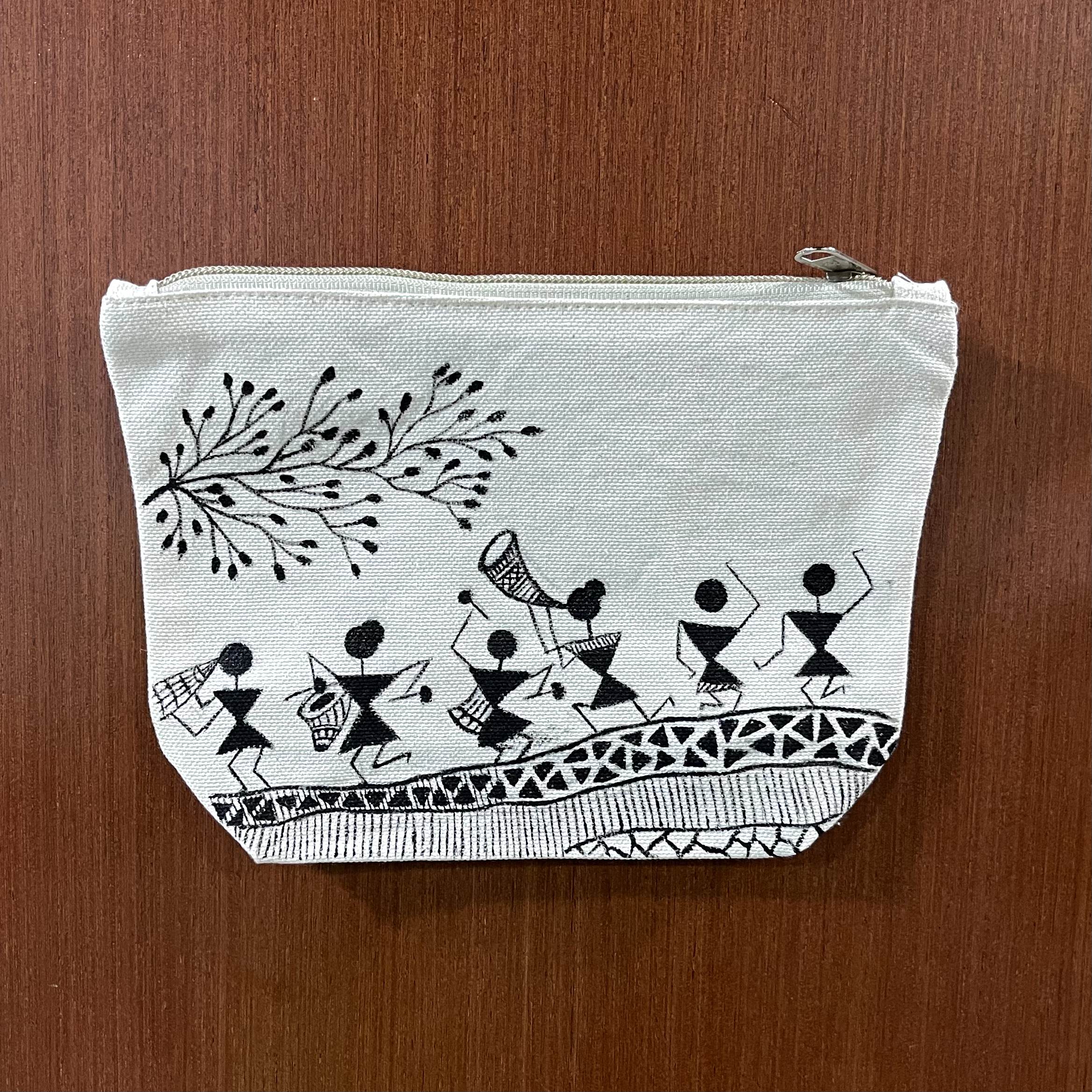Hand-painted Saura art canvas zipper pouch featuring a traditional tribal dance scene inspired by Odisha tribal painting.