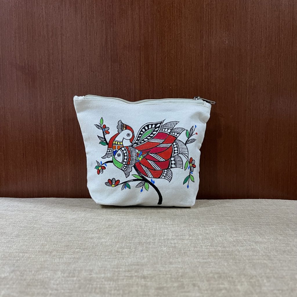 Hand-painted folk art canvas zipper pouch featuring a traditional bird motif on natural cotton canvas.