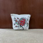 Hand-painted folk art canvas zipper pouch featuring a traditional bird motif on natural cotton canvas.